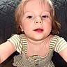 baby, blonde_hair, buttoned_shirt, child, closeup, curious, cute, expression, face, green, indoor, light_skin, looking_up, person, portrait, short_sleeves, striped_clothing, toddler, white, young_child