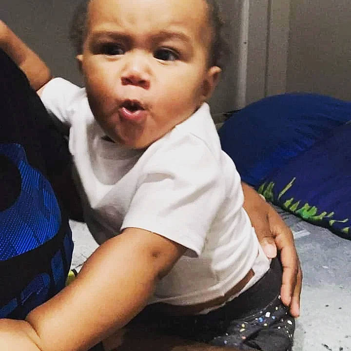 Sterling is registered to the contest to win money with this photo: baby, baby_toddler_clothing, cheek, chin, comfort, cool, ear, eyebrow, finger, forehead, gesture, happy, human, iris, mouth, neck, nose, person, skin, sleeve