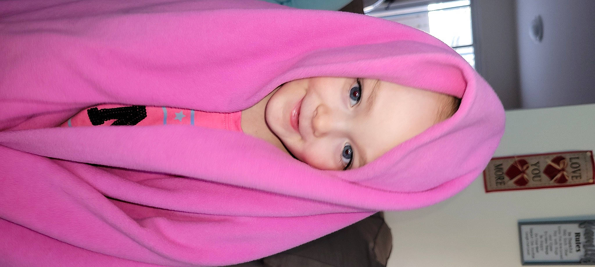 Kira is registered to the contest to win money with this photo: cheek, comfort, dress, eye, eyebrow, eyelash, face, head, headwear, jacket, joy, lip, mouth, nose, outerwear, person, pink, purple, skin, sleeve