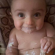 Milo joined the competition — help win amazing prizes! baby, child, food, messy, face, hand, smile, cute, eating, frosting, cake, skin, infant, closeup, happy, fun, chubby, sitting, portrait, indoor