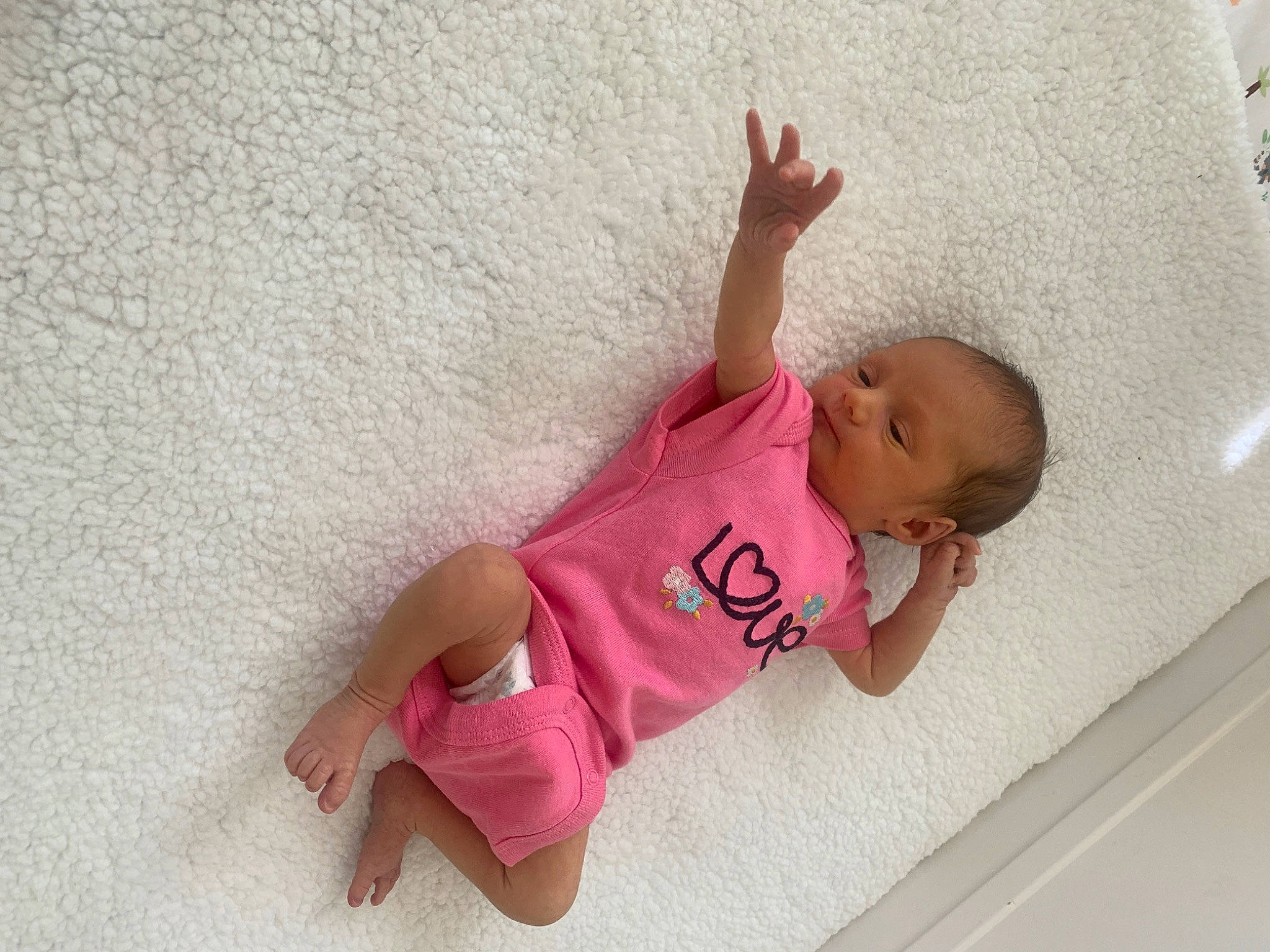 Joy is registered to the contest to win money with this photo: baby, baby_products, baby_toddler_clothing, barefoot, child, comfort, flooring, foot, fun, happy, human_leg, knee, person, room, sleeve, sock, t_shirt, textile, thigh, thumb
