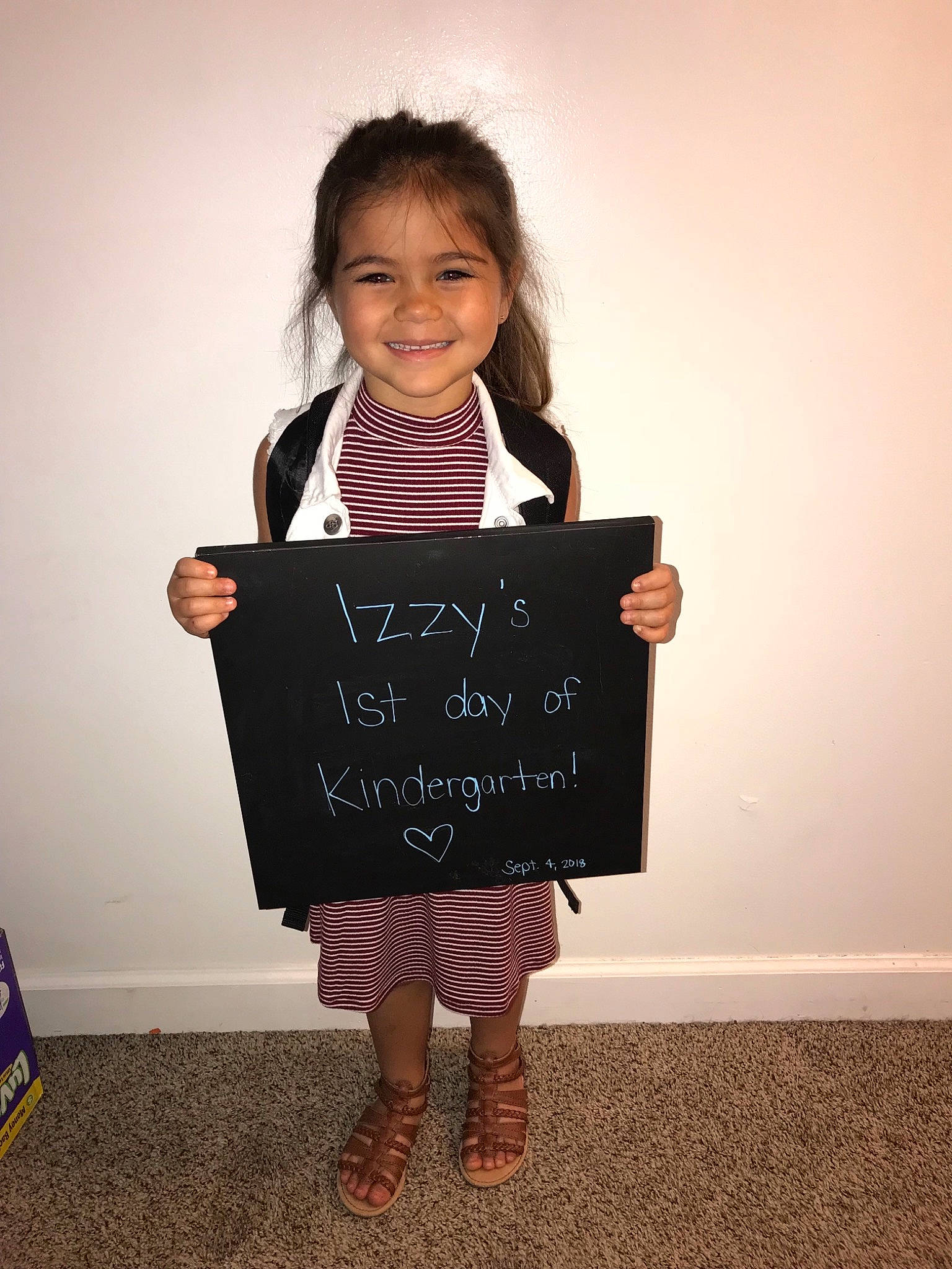 Izabella is registered to the contest to win money with this photo: blackboard, child, joy, person, pink, room, smile, toddler