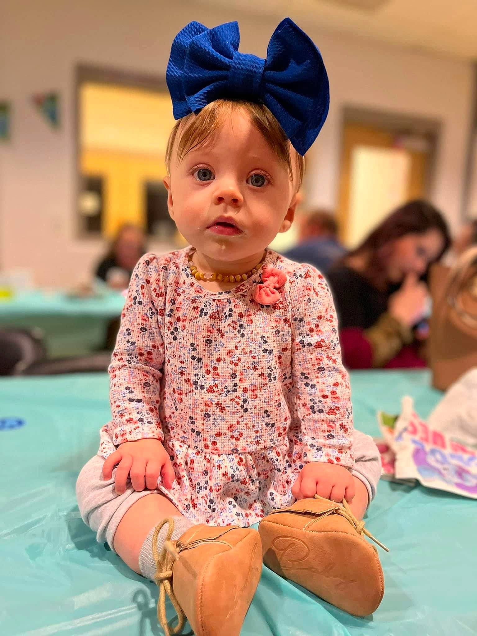 Evyn joined the competition — help win amazing prizes! baby, baby_toddler_clothing, birthday, blue, blurred, child, event, face, facial_expression, flooring, fun, happy, leisure, magenta, person, pink, play, recreation, room, sitting