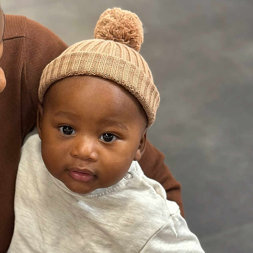 Caleb joined the competition — help win amazing prizes! baby, beanie, bodypart, bonnet, cap, clothing, face, finger, hand, happy, hat, head, hood, knitwear, newborn, person, photography, portrait, smile, sweater