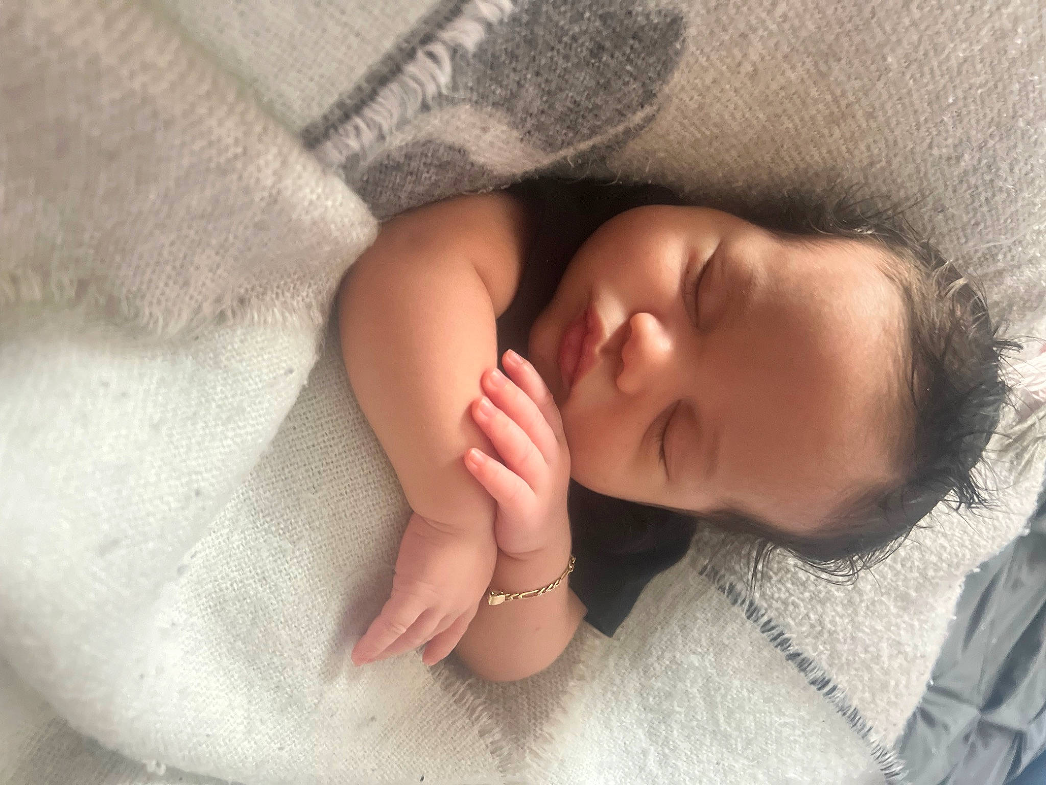 Kash is registered to the contest to win money with this photo: baby, baby_toddler_clothing, cheek, child, comfort, facial_expression, finger, foot, gesture, hand, linens, nail, nose, person, portrait_photography, skin, sleeve, textile, thumb, toddler