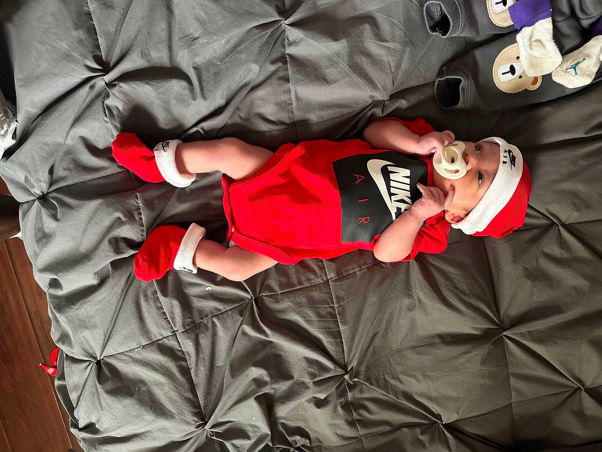Kash is registered to the contest to win money with this photo: baby_products, baby_toddler_clothing, carmine, child, comfort, couch, elbow, font, hat, headwear, linens, nap, person, room, shorts, sleeve, sportswear, t_shirt, thigh