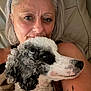 Bandit joined the competition — help win amazing prizes! woman, dog, poodle, pet, silver_hair, glasses, tattoo, couch, indoor, closeup, portrait, curly_fur, black_and_white, comfortable, relaxed, face, person, snuggle, animal, home