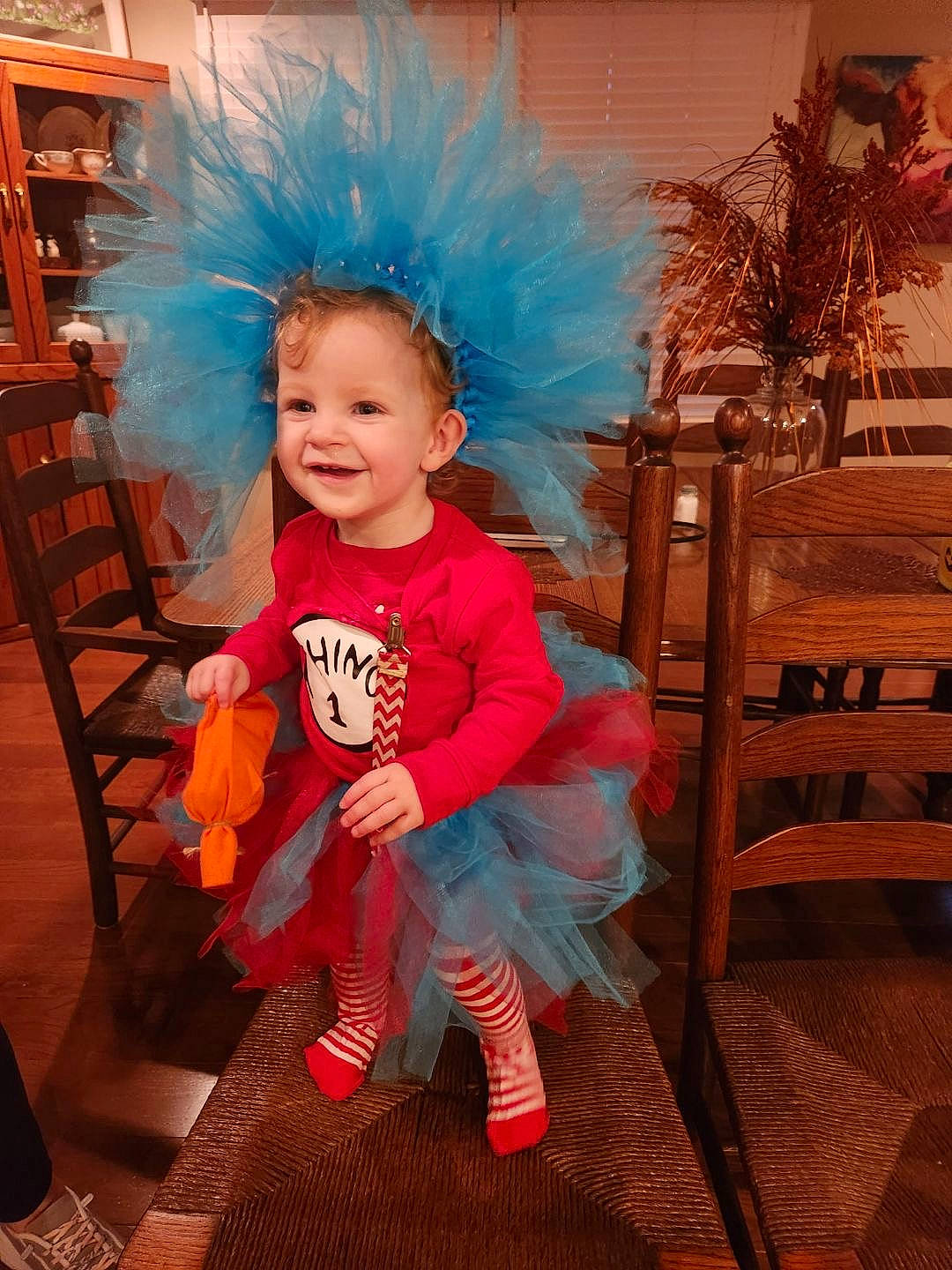 Bethany is registered to the contest to win money with this photo: baby_toddler_clothing, chair, child, costume, electric_blue, event, eye, fashion_accessory, fashion_design, flooring, fun, fur, happy, joy, magenta, person, pink, room, sitting, smile
