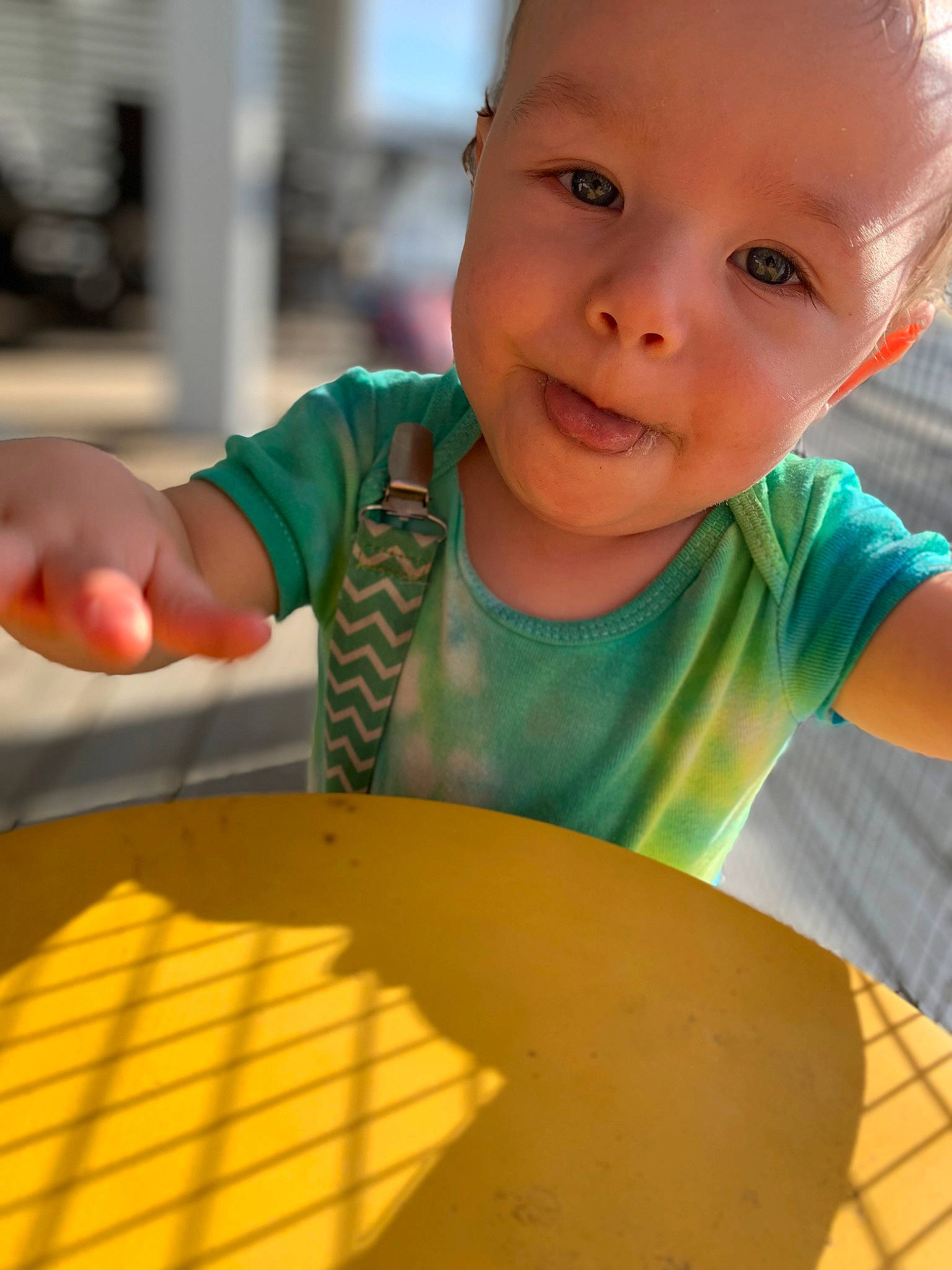 River Ray is registered to the contest to win money with this photo: arm, baby, baby_toddler_clothing, chair, cuisine, finger, fun, hand, happy, indoor_games_and_sports, leisure, orange, person, photograph, recreation, smile, snapshot, t_shirt, table, toddler