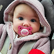 Sylvia-Rose joined the competition — help win amazing prizes! baby, pacifier, hoodie, knitted_clothing, car_seat, child, face, wide_eyes, cute, infant, pink, warm_clothing, seatbelt, portrait, close_up, soft_texture, indoor, baby_accessory, sitting, cozy