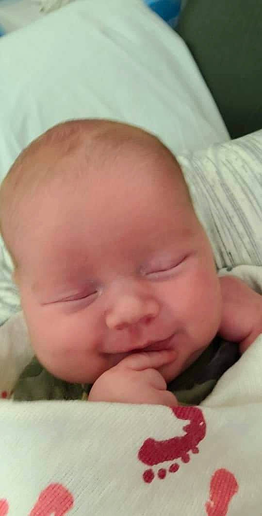 Jayme is registered to the contest to win money with this photo: baby, baby_toddler_clothing, cheek, chin, comfort, eye, eyebrow, face, facial_expression, forehead, hand, head, human_body, iris, lip, mammal, mouth, neck, nose, person