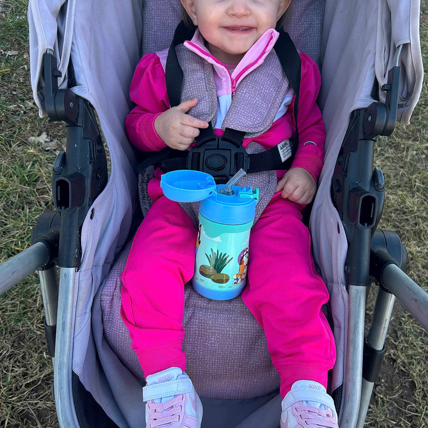 Kinslee joined the competition — help win amazing prizes! baby, bottle, clothing, coat, face, footwear, furniture, gun, head, jacket, machine, pants, person, photography, portrait, shaker, shoe, stroller, weapon, wheel