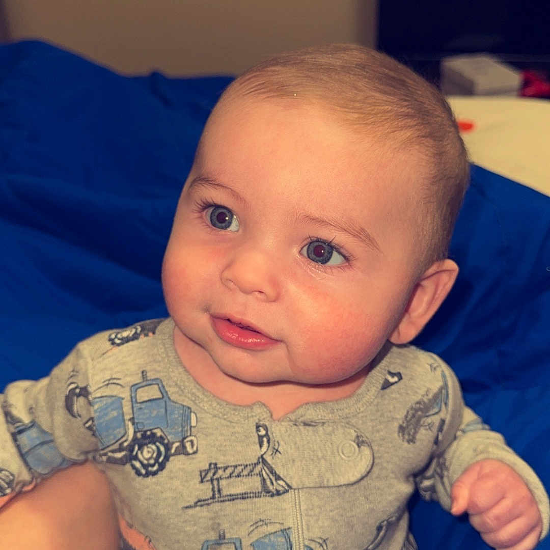 Michael is registered to the contest to win money with this photo: baby, bodypart, clothing, couch, cushion, face, finger, furniture, hand, happy, head, homedecor, pants, person, photography, portrait, skin, smile, t_shirt, tattoo