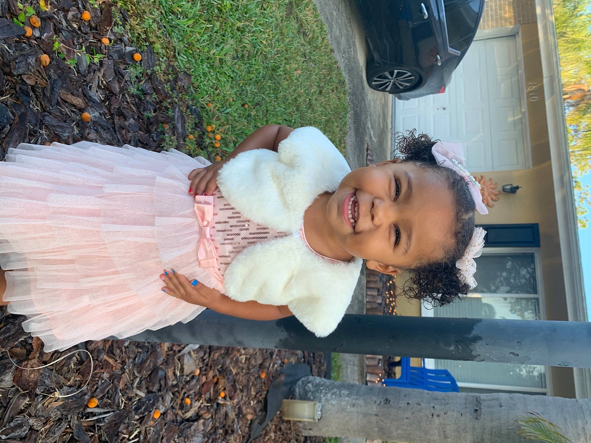 Aiyanna is registered to the contest to win money with this photo: automotive_lighting, automotive_tire, baby, baby_toddler_clothing, car, child, fun, grass, hairstyle, happy, joy, leisure, people_in_nature, person, plant, sitting, smile, tire, toddler, tree