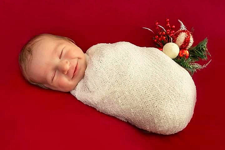 Lilah is registered to the contest to win money with this photo: baby, baby_sleeping, baby_toddler_clothing, carmine, child, comfort, fashion_accessory, foot, fur, linens, nap, person, portrait_photography, product, room, rose, sleep, still_life_photography, toddler, wood