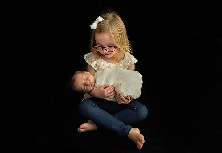 Amanda is registered to the contest to win money with this photo: baby, barefoot, cheek, child, chin, comfort, darkness, elbow, entertainment, event, flash_photography, foot, fun, gesture, happy, performing_arts, person, portrait, portrait_photography, sitting