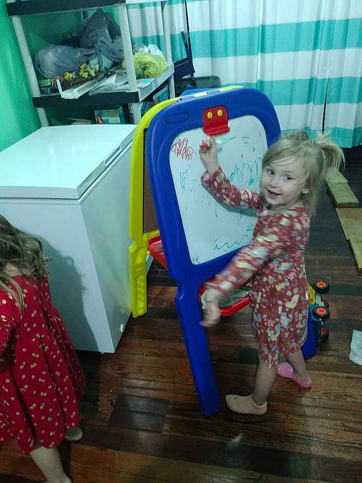 Amanda joined the competition — help win amazing prizes! baby, baby_products, baby_toddler_clothing, baby_toys, chair, child, event, flooring, fun, green, joy, leisure, magenta, pattern, person, play, room, sandal, sitting, smile