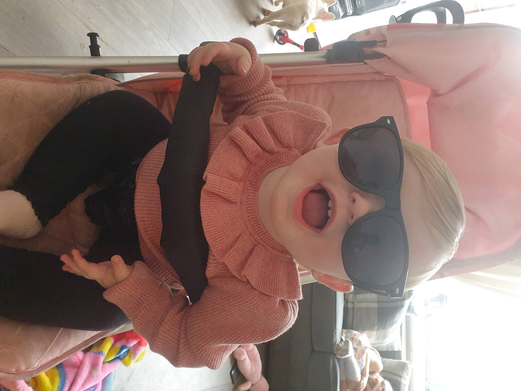 Ellie-mae is registered to the contest to win money with this photo: abdomen, auto_part, baby, baby_products, child, comfort, eyewear, fun, goggles, hat, headgear, person, personal_protective_equipment, product, room, smile, sunglasses, thigh, toddler, vacation