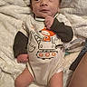 Jackson joined the competition — help win amazing prizes! baby, infant, onesie, blanket, white_blanket, clothing, face, expression, hand, foot, person, lying_down, cute, newborn, skin, indoors, adult_leg, fabric, soft, cozy