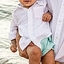 toddler, child, baby, person, beach, water, waves, white_shirt, mint_shorts, curly_hair, barefoot, holding, adult, smiling, outdoor, summer, cute, happy, portrait, nature