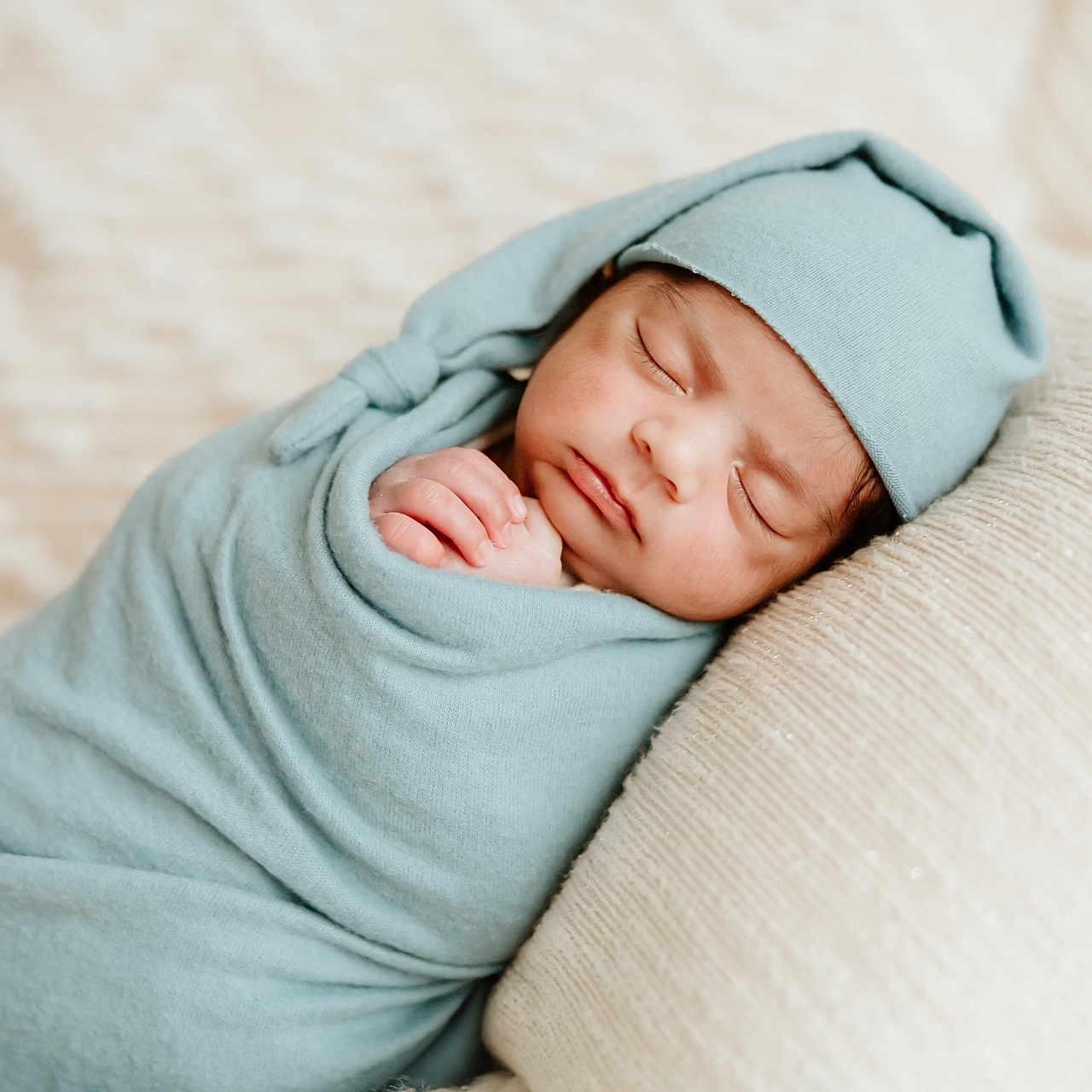 Aarvik joined the competition — help win amazing prizes! baby, blanket, calm, child, closeup, comfort, cozy, cute, hat, indoors, infant, newborn, peaceful, pillow, portrait, rest, sleeping, soft, swaddled, wrapped