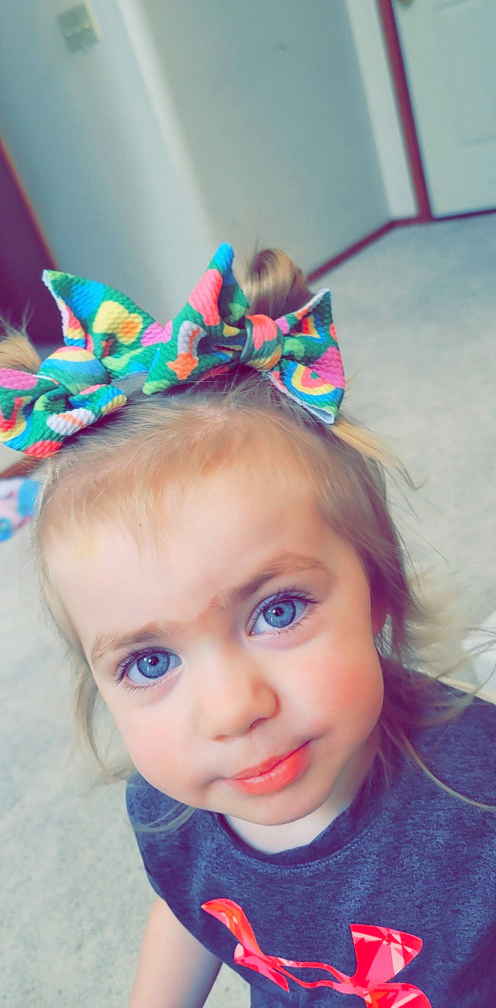 Riley is registered to the contest to win money with this photo: beauty, child, clothing, costume_hat, ear, electric_blue, eyelash, face, grass, hair_accessory, happy, headband, headgear, headpiece, jewellery, magenta, person, pink, purple, sunglasses