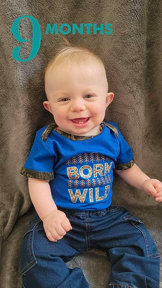 Connor is registered to the contest to win money with this photo: baby, baby_toddler_clothing, cheek, chin, clothing, cool, eye, flash_photography, hair, happy, head, human_body, iris, jeans, joy, nose, person, skin, sleeve, smile