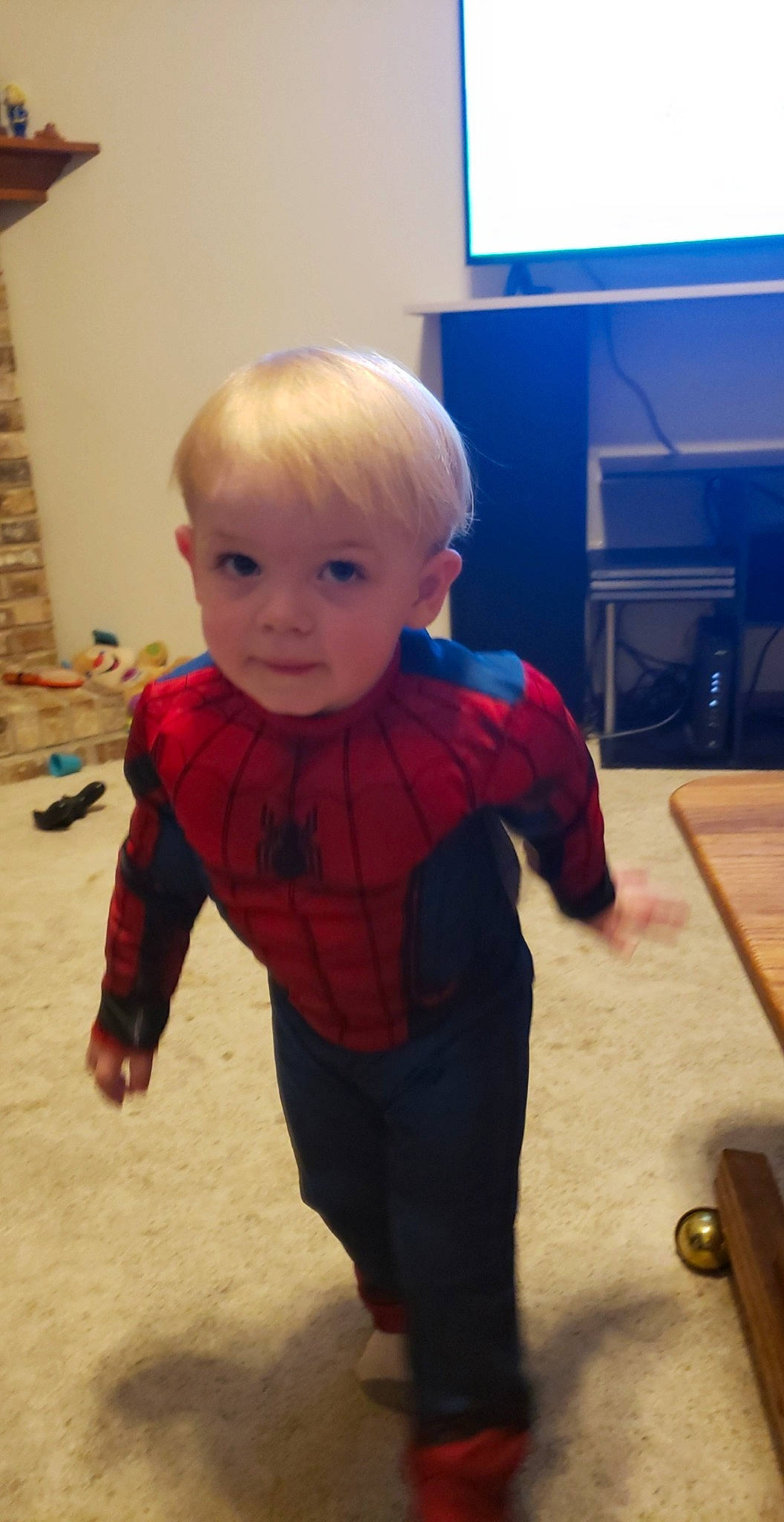 Gabe is registered to the contest to win money with this photo: arm, cheek, child, head, joint, person, play, shoulder, sleeve, standing, toddler