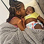 Ariana Durodola is registered to the contest to win money with this photo: affection, baby, bandage, blanket, braids, child, colorful_diaper, couch, cozy, cute, family, indoors, kiss, love, portrait, sibling, skin, smile, toddler, yellow_shirt