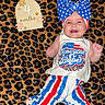 Montgomerie is registered to the contest to win money with this photo: accessories, baby, bonnet, cap, clothing, cushion, face, happy, hat, head, homedecor, newborn, pants, person, photography, portrait, quilt, shorts, smile, t_shirt