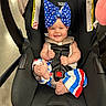 Montgomerie is registered to the contest to win money with this photo: accessories, baby, bodypart, cap, clothing, face, finger, furniture, hat, head, homedecor, machine, newborn, person, photography, portrait, sunglasses, transportation, vehicle, wheel