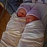 Catalina is registered to the contest to win money with this photo: newborn, twins, babies, infants, sleeping, swaddled, blanket, beanie, striped_hat, hospital, crib, footprints, keepsake_card, portrait, close_up, peaceful, family, infant_care, matching, adorable