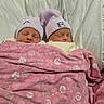babies, newborns, twins, sleeping, infants, portrait, indoors, bed, blanket, pink, hats, matching_outfits, cuddling, peaceful, family, nursery, white_bedding, closeup, resting, photography