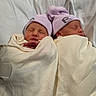 newborn, twins, baby, infant, sleeping, swaddled, hats, pink, white, blanket, hospital, portrait, two_faces, peaceful, cozy, nap, lying_down, matching_outfits, closeup, family