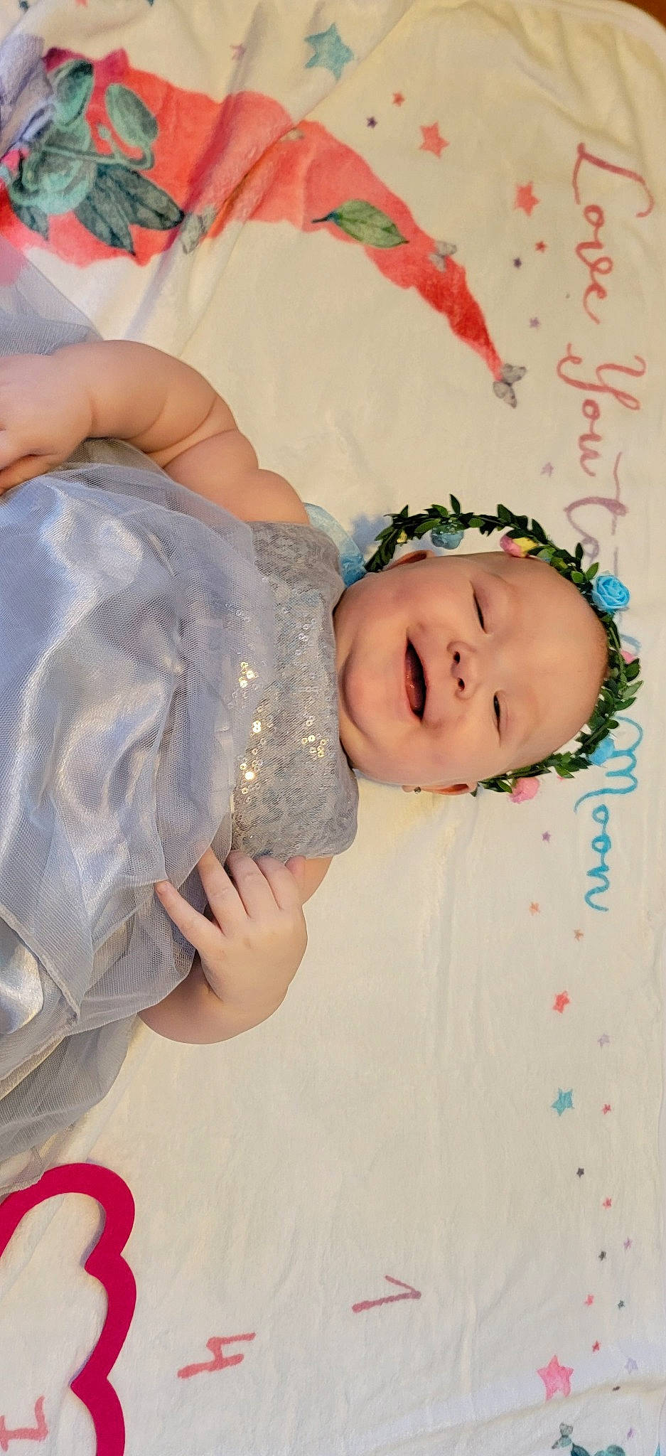 Sophia is registered to the contest to win money with this photo: baby, baby_toddler_clothing, cheek, child, eye, eyebrow, face, finger, fun, hair, hair_accessory, happy, head, headgear, human_body, joy, mouth, nose, person, skin