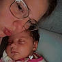 accessories, baby, bodypart, clothing, coat, couch, earring, face, finger, furniture, glasses, hand, head, jewelry, newborn, people, person, photography, portrait, sleeping
