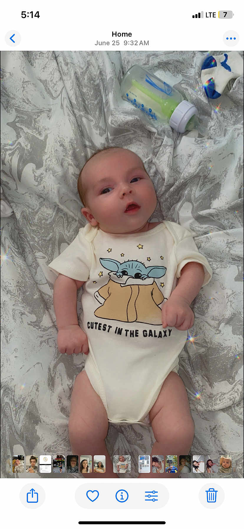 Trenton joined the competition — help win amazing prizes! baby, infant, onesie, baby_yoda, cute, lying_down, blanket, bottle, sock, marble_pattern, face, hands, legs, clothing, child, portrait, indoors, soft_lighting, expression, newborn