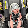 Trenton joined the competition — help win amazing prizes! baby, infant, car_seat, shopping_cart, hooded_outfit, clothing, child, seat_belt, foot, hand, expression, indoor, retail, store, shopping, curious, cute, seat, person, safety