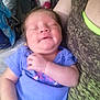 Genesis is registered to the contest to win money with this photo: baby, newborn, infant, person, sleeping, smiling, purple_clothing, arm, hand, indoor, cushion, fabric, closeup, face, child, human, holding, relaxing, comfort, resting