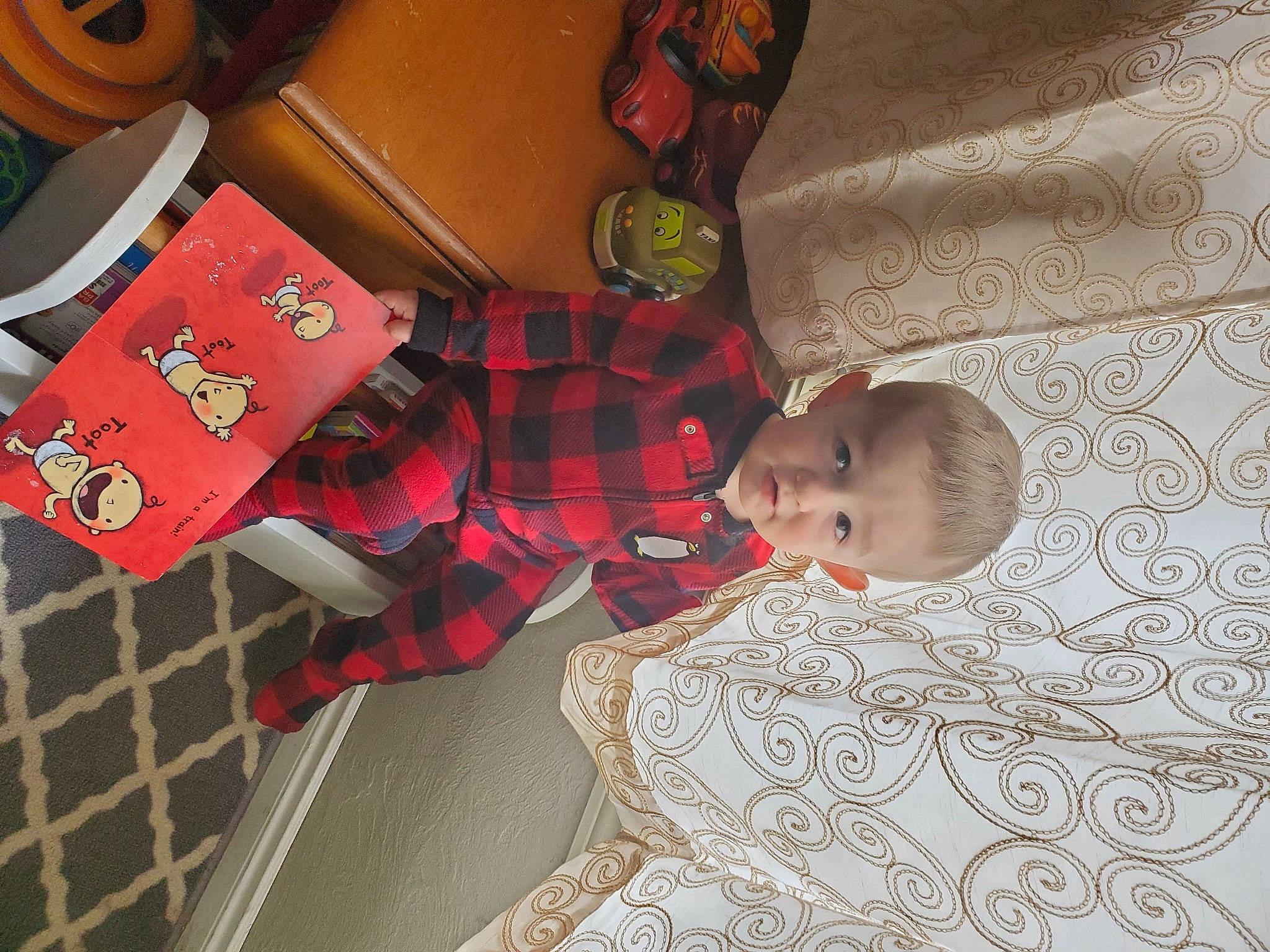 Ezekiel joined the competition — help win amazing prizes! baby, baby_products, baby_toddler_clothing, carmine, child, comfort, flooring, fun, house, linens, pattern, person, plaid, room, sitting, smile, sock, suit, toddler, toy