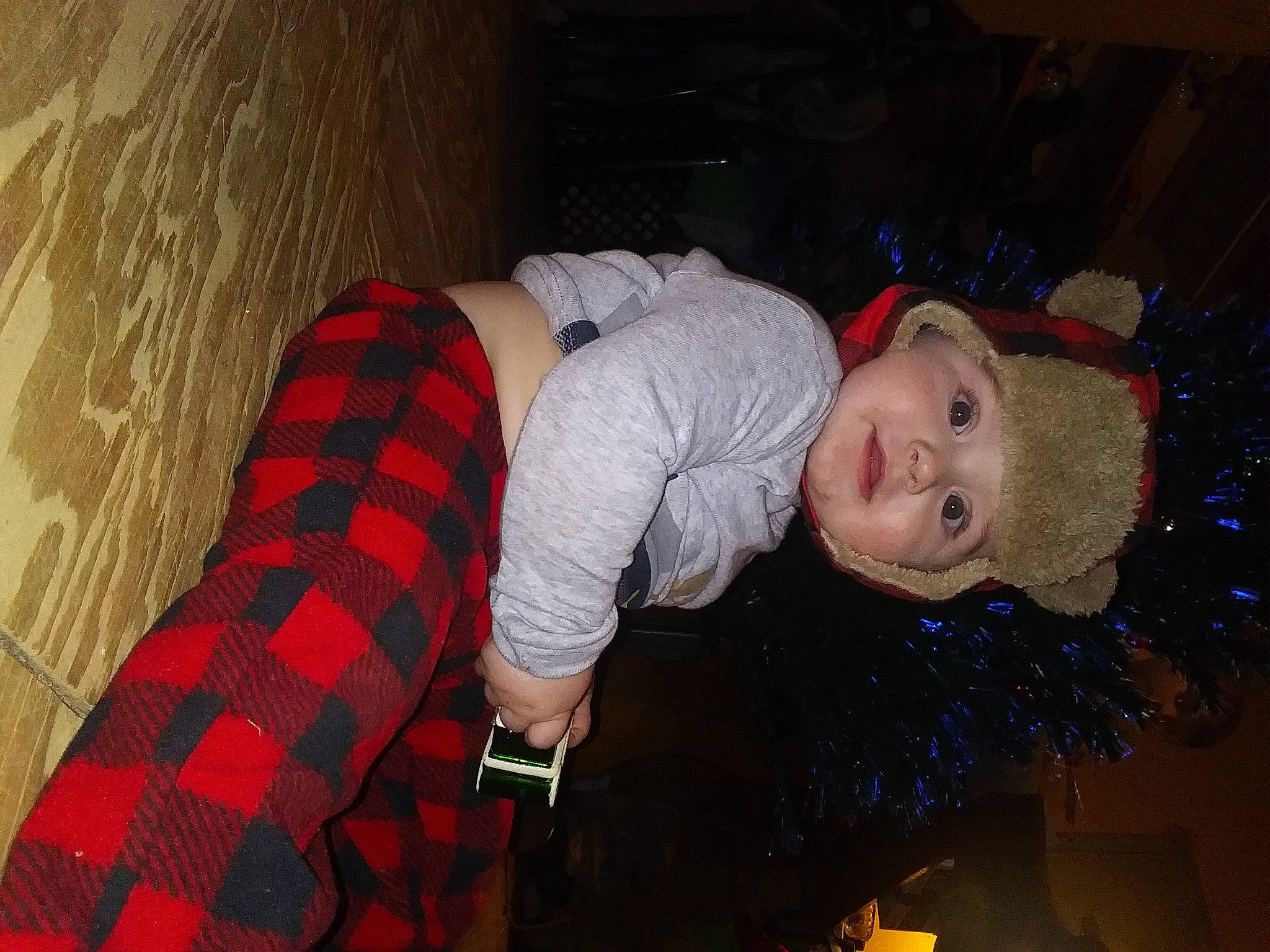 Waylon is registered to the contest to win money with this photo: carmine, child, comfort, cool, event, flash_photography, fun, hat, headwear, human_body, human_leg, pattern, person, plaid, room, sitting, sleeve, tartan, textile, thigh