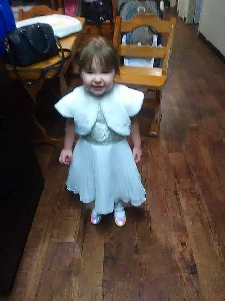 Cherish is registered to the contest to win money with this photo: baby_toddler_clothing, chair, child, dress, event, floor, flooring, fun, happy, hardwood, head, joy, laminate_flooring, person, room, sock, table, toddler, varnish, wood