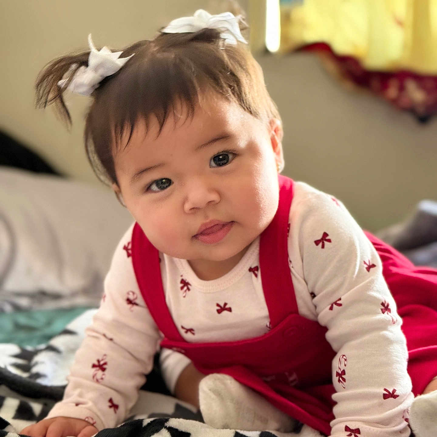Esmeralda joined the competition — help win amazing prizes! baby, bedroom, bows, child, chubby_cheeks, cozy, crawling, curious_expression, cute, face, hands, indoors, infant, natural_light, patterned_blanket, pigtails, red_dress, soft_focus, white_shirt, window