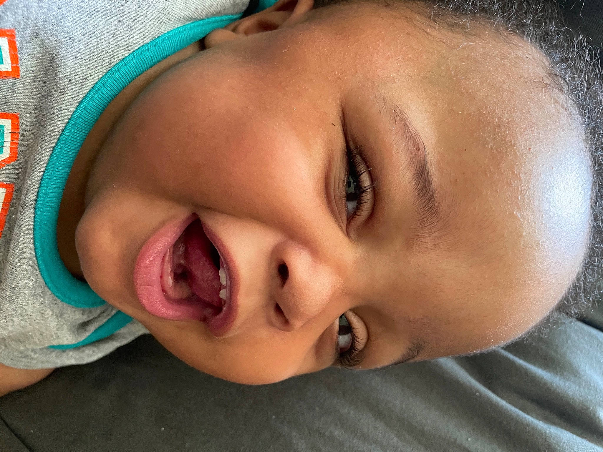 Gabriel is registered to the contest to win money with this photo: baby, cheek, chin, cool, ear, eyebrow, eyelash, facial_expression, forehead, grass, happy, human_body, iris, lip, mouth, neck, nose, person, skin, smile