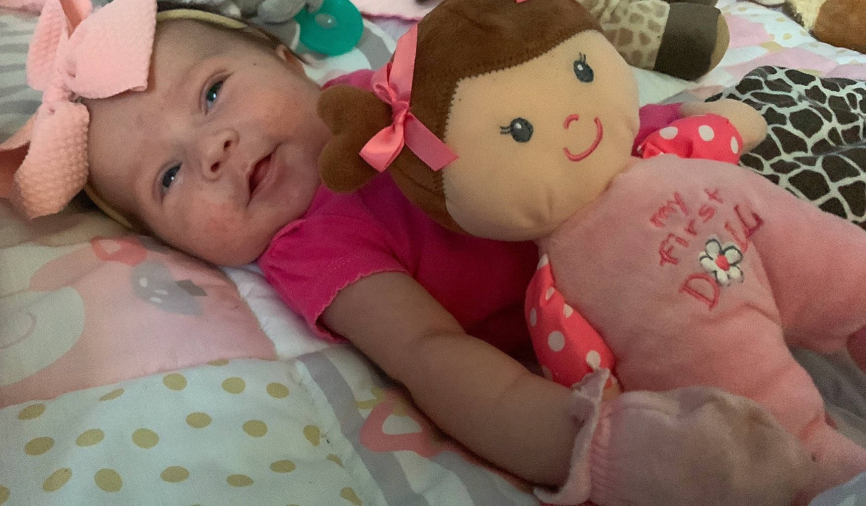 Zayleigh is registered to the contest to win money with this photo: baby, baby_toddler_clothing, cheek, comfort, eye, face, facial_expression, finger, happy, head, headgear, human_body, mouth, nose, person, pink, skin, textile, toddler, toy