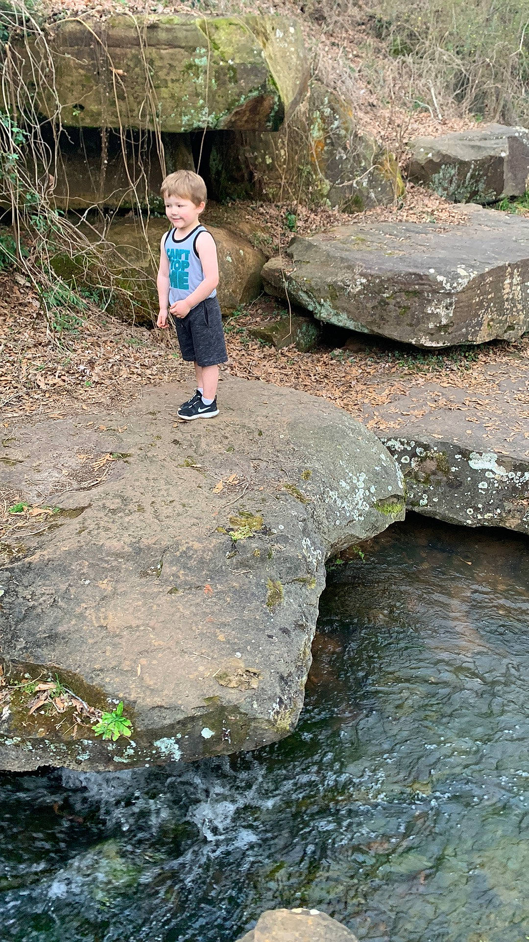 Zaydon joined the competition — help win amazing prizes! bedrock, creek, fun, geology, grass, joy, landscape, leisure, nature_reserve, outcrop, person, plant, recreation, rock, shorts, soil, stream, toddler, water, watercourse