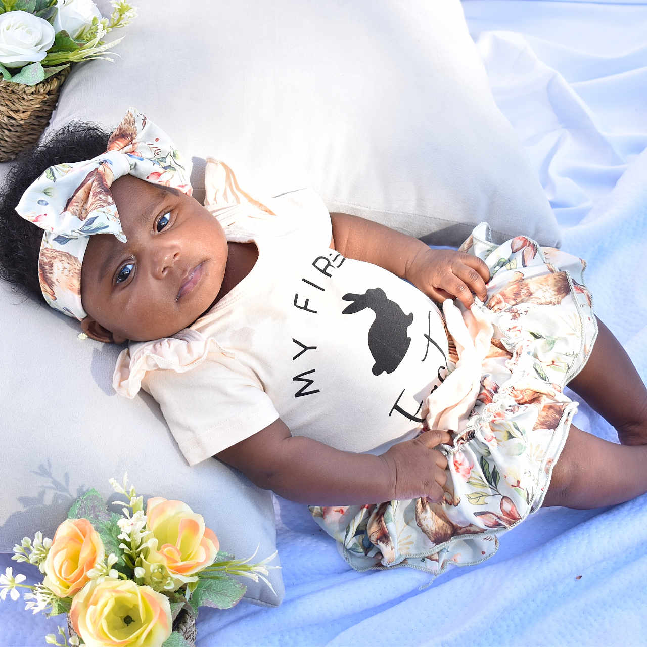 Assata Patterson is registered to the contest to win money with this photo: accessories, baby, bodypart, bonnet, clothing, dress, face, finger, flower, flowerarrangement, flowerbouquet, hand, hat, head, jewelry, pattern, person, plant, ring, rose