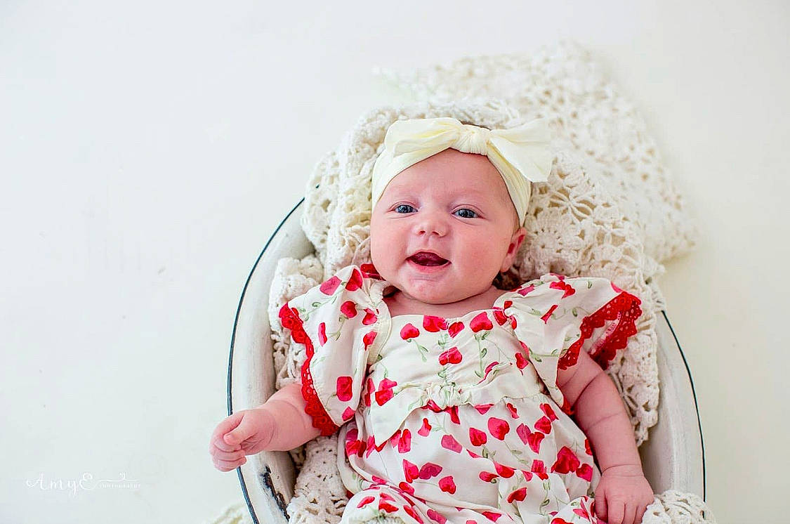 Karsyn joined the competition — help win amazing prizes! baby, baby_toddler_clothing, child, clothing, comfort, day_dress, dress, face, fashion_accessory, flash_photography, hair_accessory, happy, headwear, iris, pattern, person, pink, portrait_photography, sleeve, smile