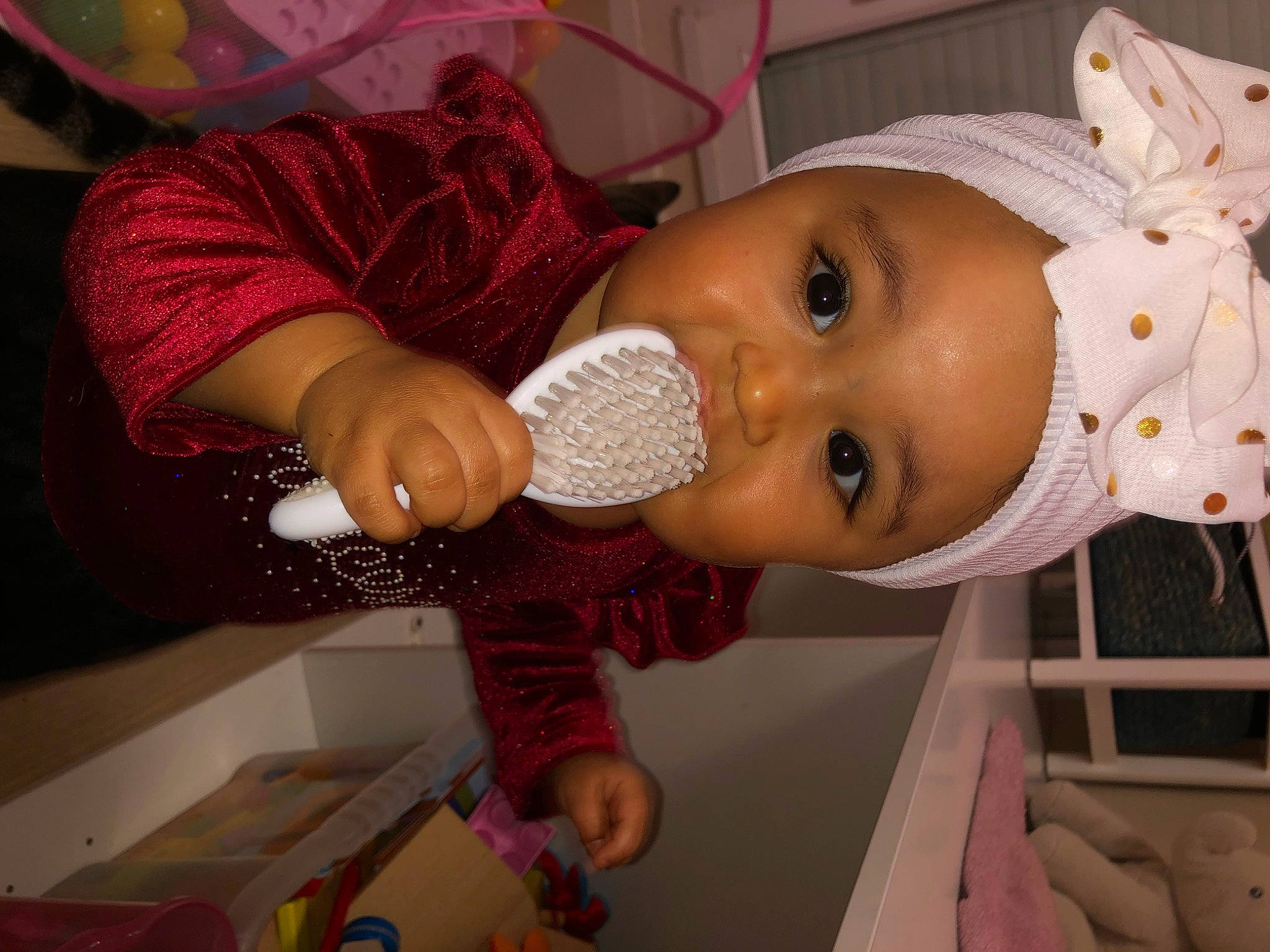 Aliyah participe au concours pour gagner de l'argent avec cette photo : baby, baby_products, baby_toddler_clothing, cheek, child, drinkware, ear, eyelash, happy, hat, headwear, lip, nail, nose, pattern, person, plastic_bottle, room, skin, toddler