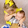affection, baby, blue_pants, child, cute, family, hug, indoor, kiss, love, peaceful, plaid_shirt, portrait, siblings, smiling, studio, suspenders, toddler, yellow_bow, yellow_shirt